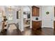 Inviting entryway featuring hardwood floors, stylish decor, and an open view to the dining area at 2800 Tuscany Park Dr, Lawrenceville, GA 30043