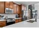 Modern kitchen with stainless steel appliances, quartz countertop and a subway tile backsplash at 2800 Tuscany Park Dr, Lawrenceville, GA 30043