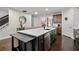 Spacious kitchen island with quartz countertops, stainless steel appliances, and breakfast bar at 2800 Tuscany Park Dr, Lawrenceville, GA 30043