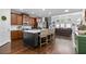 Open-concept kitchen featuring a large island with seating and stainless steel appliances at 2800 Tuscany Park Dr, Lawrenceville, GA 30043