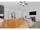 Bright main bedroom with seating area, offering relaxation and comfort, complete with ceiling fan at 2800 Tuscany Park Dr, Lawrenceville, GA 30043