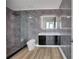 Sleek bathroom showcasing grey marble-look tile, a glass shower, and a modern vanity at 3324 Peachtree Ne Rd # 2004, Atlanta, GA 30326