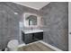 Modern bathroom with illuminated mirror, sleek vanity, and stylish marble-look tiling at 3324 Peachtree Ne Rd # 2004, Atlanta, GA 30326