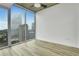Bedroom boasting city views from large windows and light wood-look flooring at 3324 Peachtree Ne Rd # 2004, Atlanta, GA 30326