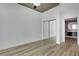 Bedroom featuring light wood-look flooring, and access to a closet and the bathroom at 3324 Peachtree Ne Rd # 2004, Atlanta, GA 30326