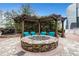 Inviting outdoor fire pit area with comfortable seating and views of skyscrapers at 3324 Peachtree Ne Rd # 2004, Atlanta, GA 30326