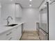 Modern kitchen with stainless steel appliances, white cabinets, and sleek countertops at 3324 Peachtree Ne Rd # 2004, Atlanta, GA 30326