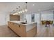 Bright kitchen features a spacious island, modern lighting, and stainless steel appliances at 3324 Peachtree Ne Rd # 2004, Atlanta, GA 30326