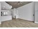 Open floorplan showcasing a sleek, modern kitchen with stainless steel appliances and concrete ceilings at 3324 Peachtree Ne Rd # 2004, Atlanta, GA 30326