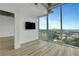 Bright living room featuring floor-to-ceiling windows with a panoramic city view at 3324 Peachtree Ne Rd # 2004, Atlanta, GA 30326