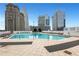 Rooftop pool area with lounge chairs and a view of the city skyline at 3324 Peachtree Ne Rd # 2004, Atlanta, GA 30326