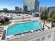 Rooftop pool area with lounge chairs overlooking the city at 3324 Peachtree Ne Rd # 2004, Atlanta, GA 30326