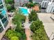 Aerial view of a rooftop terrace with a pool, tables, chairs and landscaping at 3324 Peachtree Ne Rd # 2004, Atlanta, GA 30326