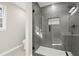 Bathroom features frameless glass shower and white vanity with black hardware at 5427 Fieldgreen Dr, Stone Mountain, GA 30088