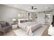 The main bedroom features a ceiling fan and a sliding barn door leading to an ensuite bathroom at 5427 Fieldgreen Dr, Stone Mountain, GA 30088