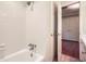 A bathroom featuring a white tiled shower and an open door to a closet at 3592 Midvale Cv, Tucker, GA 30084