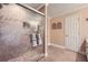 Bathroom featuring tiled shower, neutral walls, and window at 3592 Midvale Cv, Tucker, GA 30084