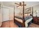 Bedroom with hardwood floors, ceiling fan, bedside table, and bright windows at 3592 Midvale Cv, Tucker, GA 30084