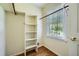 Walk-in closet with built-in shelving and window at 3592 Midvale Cv, Tucker, GA 30084