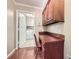 Hallway with desk space and view of laundry room featuring a white washer and dryer at 3592 Midvale Cv, Tucker, GA 30084