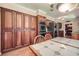 Kitchen highlighting custom cabinets, stainless appliances, and adjacent dining area at 3592 Midvale Cv, Tucker, GA 30084