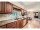 A kitchen boasting custom wood cabinetry, granite counters, and stainless steel appliances at 3592 Midvale Cv, Tucker, GA 30084