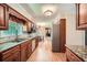 Kitchen offering stainless steel appliances, custom cabinets, granite countertops, and wood floors at 3592 Midvale Cv, Tucker, GA 30084