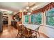 Eat-in kitchen with custom cabinetry, stainless steel appliances, and a view of the treed backyard at 3592 Midvale Cv, Tucker, GA 30084