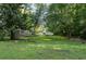 Scenic view of backyard with picnic table and water feature at 5143 Meadowlake Ln, Dunwoody, GA 30338