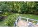 Scenic backyard view from the deck, showcasing lush greenery and a private setting at 5143 Meadowlake Ln, Dunwoody, GA 30338