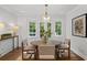 Cozy dining area featuring a round table, natural light and a view of the outdoors at 5143 Meadowlake Ln, Dunwoody, GA 30338