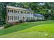 Charming two-story home with classic design, neat landscaping, and inviting curb appeal at 5143 Meadowlake Ln, Dunwoody, GA 30338