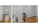 Hallway with hardwood floors and a staircase leading to the lower level at 5143 Meadowlake Ln, Dunwoody, GA 30338
