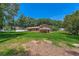 Spacious backyard with a partial view of the home's exterior and a white fence at 5401 Smoke Rise Dr, Smoke Rise, GA 30087