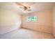 Cozy bedroom with neutral carpet and a window that offers natural light at 5401 Smoke Rise Dr, Smoke Rise, GA 30087