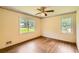 Bedroom featuring neutral walls, hardwood floors, and natural light at 5401 Smoke Rise Dr, Smoke Rise, GA 30087