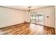 Open dining area with hardwood floors, modern lighting, and sliding door to patio at 5401 Smoke Rise Dr, Smoke Rise, GA 30087