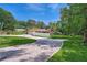 Long driveway leading to a well-kept home with an attached garage and fenced yard at 5401 Smoke Rise Dr, Smoke Rise, GA 30087