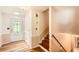 Inviting foyer with hardwood floors, a decorative door, and staircase to the upper level at 5401 Smoke Rise Dr, Smoke Rise, GA 30087