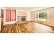Cozy living room featuring a fireplace, built-in shelves, and a large window at 5401 Smoke Rise Dr, Smoke Rise, GA 30087