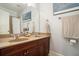 Bright bathroom boasts double sinks with wood cabinets and ample counter space at 1126 Francis Ne St, Atlanta, GA 30319