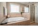 Well-appointed bathroom with a relaxing soaking tub and a separate tiled glass shower at 1126 Francis Ne St, Atlanta, GA 30319