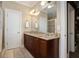 Spacious bathroom with a double vanity, granite countertops, and tile flooring at 1126 Francis Ne St, Atlanta, GA 30319