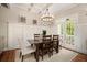 Bright dining room with wainscoting, chandelier, and French doors leading to the balcony at 1126 Francis Ne St, Atlanta, GA 30319