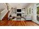 Warm living room boasting hardwood floors, a fireplace, built-in bookshelves, and lots of natural light at 1126 Francis Ne St, Atlanta, GA 30319