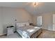 Bedroom featuring neutral walls, carpet, vaulted ceiling, and large window at 1171 Pine Acre Dr, Sugar Hill, GA 30518