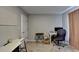 This bedroom has neutral walls and carpeting, a desk, and a white board on the wall at 1171 Pine Acre Dr, Sugar Hill, GA 30518