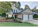 Charming two-story home with well-maintained landscaping and a two-car garage in a suburban neighborhood at 1171 Pine Acre Dr, Sugar Hill, GA 30518