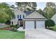 Charming two-story home with well-maintained landscaping and a two-car garage in a suburban neighborhood at 1171 Pine Acre Dr, Sugar Hill, GA 30518
