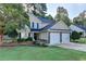 Charming two-story home with well-maintained landscaping and a two-car garage in a suburban neighborhood at 1171 Pine Acre Dr, Sugar Hill, GA 30518